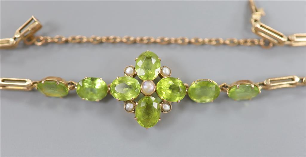 A late Victorian 9ct, peridot and seed pearl cluster set bracelet(adapted), approx. 16.5cm, gross 9 grams.